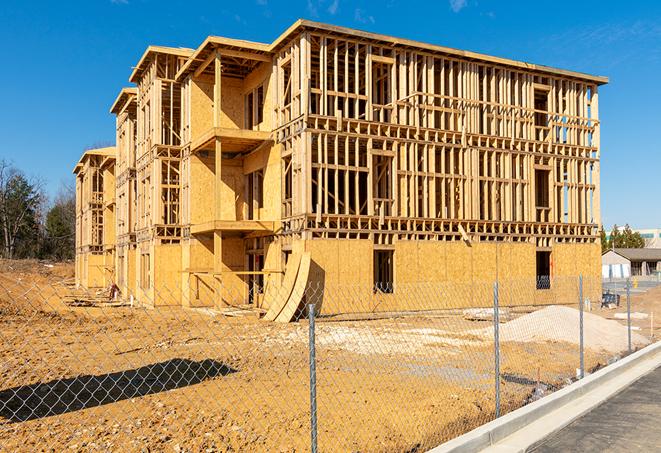 construction site fencing offers protection and privacy in Roslindale